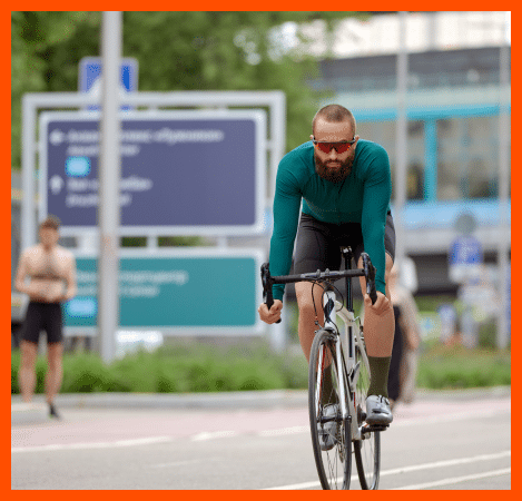 Brooklyn man on a bike riding through the city.