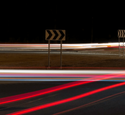 Traffic lights, brake lights, head lights all blurred in long exposure shot at night.